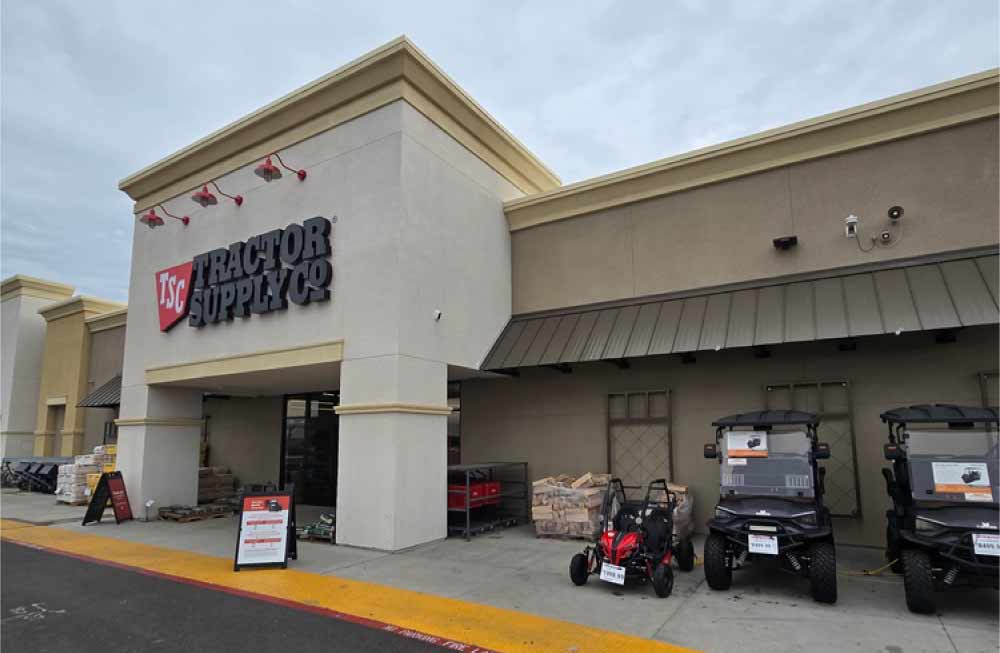 Professional stucco installation on a Tractor Supply Co. storefront, providing a durable and polished brand identity for a high-traffic retail location.