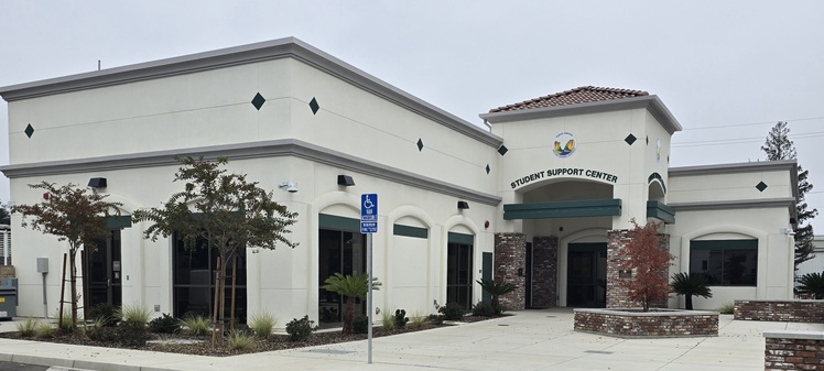 Full view of the Kings Canyon Student Support Center building showcasing uniform stucco application and professional finishing by Cal Pro Plastering.